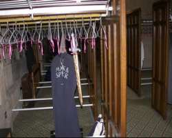 There is a purple ribbon where the members' can ha There is a purple ribbon where the members' can hang their swords alongside their coats in the cloakroom. It is also said that there are marked in the